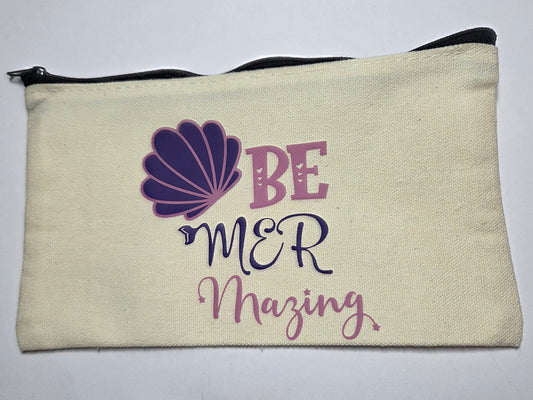 Canvas pouch with 'Be Mer Mazing' text and purple shell design on a white background